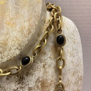 Yves St Laurent vintage 37” gold tone oval onyx cabochon necklace.